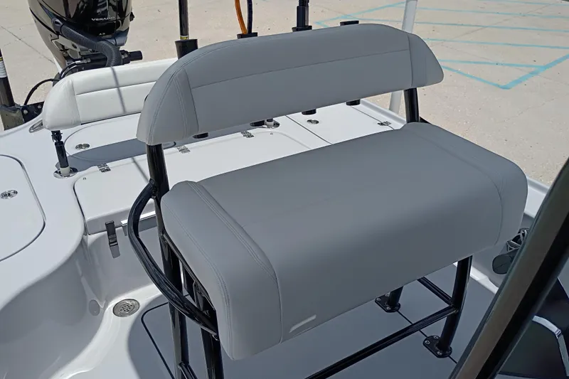 Slide: The Image of 2025 Yellowfin 24 CE boat with gray seating and sleek design. - 16