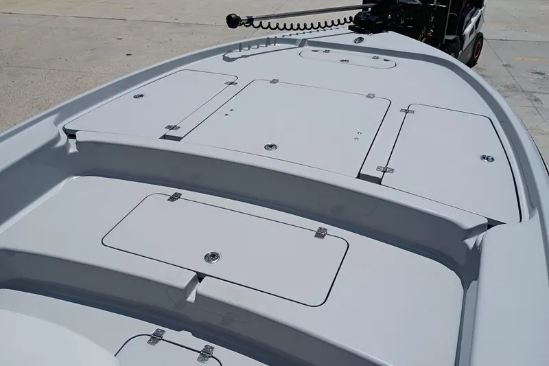Slide: The Image of 2025 Yellowfin 24 CE boat deck with multiple storage compartments. - 18