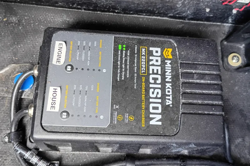 Slide: The Image of Minn Kota Precision MK 220PCL on-board battery charger in Yellowfin 24 CE, 2025 model. - 21