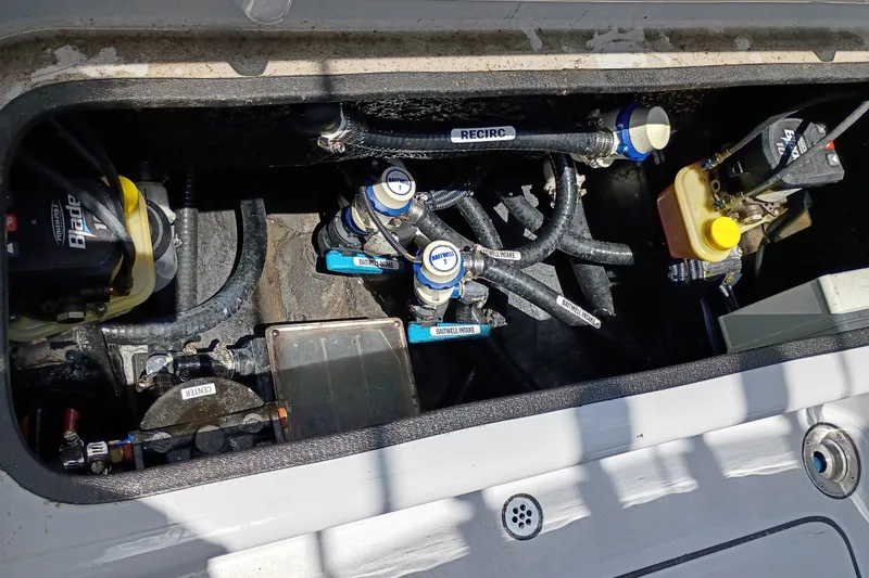Slide: The Image of 2025 Yellowfin 24 CE boat plumbing system with labeled valves and hoses. - 25
