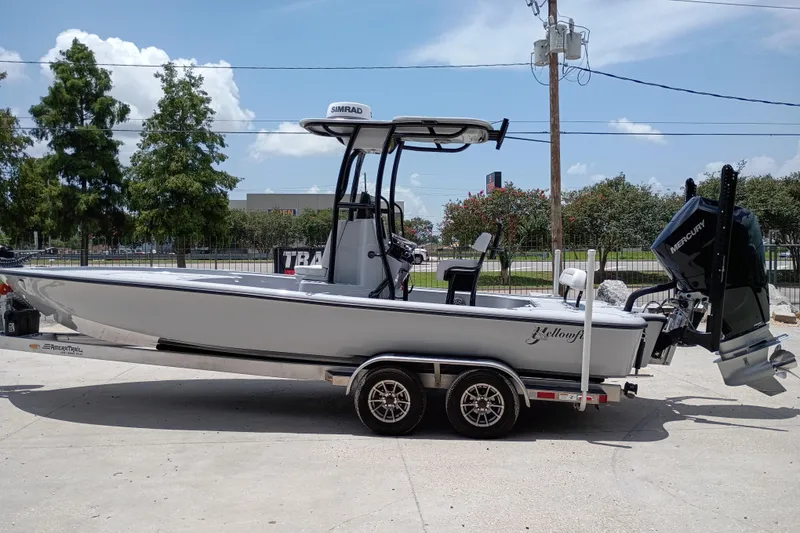 Slide: The Image of 2025 Yellowfin 24 CE boat on trailer, featuring Mercury outboard motor. - 5