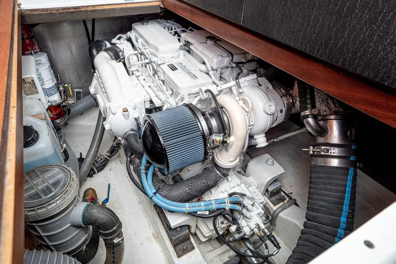 Slide: The Image of Engine room of 2014 Beneteau Swift Trawler 34, showcasing detailed mechanical components. - 20