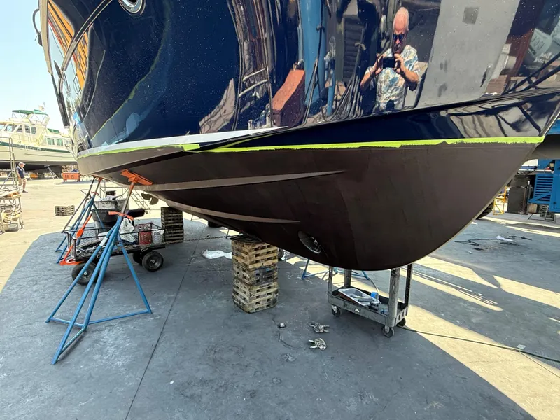 Slide: The Image of 2014 Beneteau Swift Trawler 34 in dry dock, hull maintenance underway. - 22