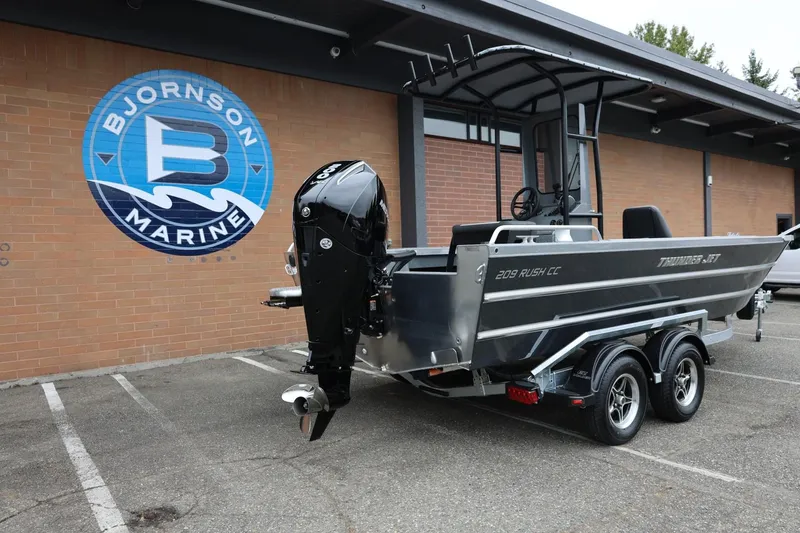 Slide: The Image of 2026 Thunder Jet 209 Rush Center Console boat at Bjornson Marine dealership. - 10