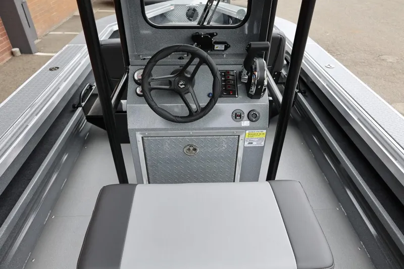 Slide: The Image of 2026 Thunder Jet 209 Rush Center Console interior with steering wheel and controls. - 14