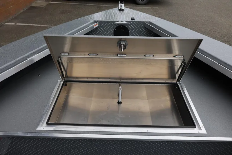 Slide: The Image of Open storage compartment on 2026 Thunder Jet 209 Rush Center Console boat. - 22
