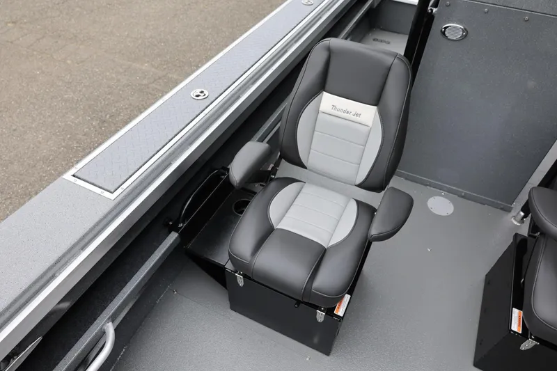 Slide: The Image of 2026 Thunder Jet 209 Rush Center Console boat seat, black and gray design. - 25