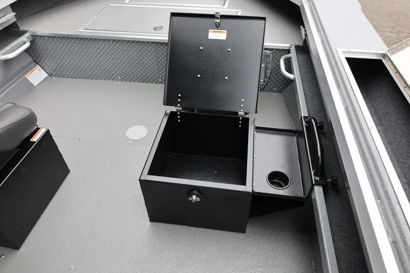 Slide: The Image of 2026 Thunder Jet 209 Rush Center Console interior with open storage compartment. - 29