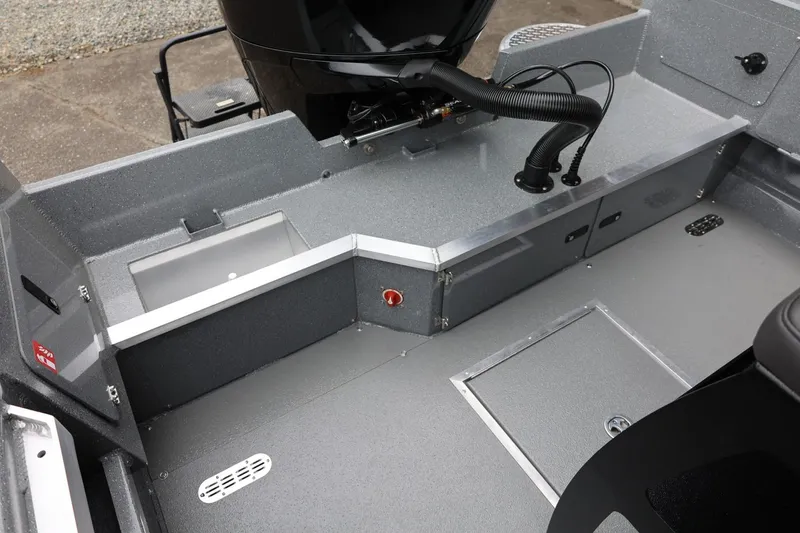 Slide: The Image of 2026 Thunder Jet 209 Rush Center Console interior with storage compartments and sleek design. - 30