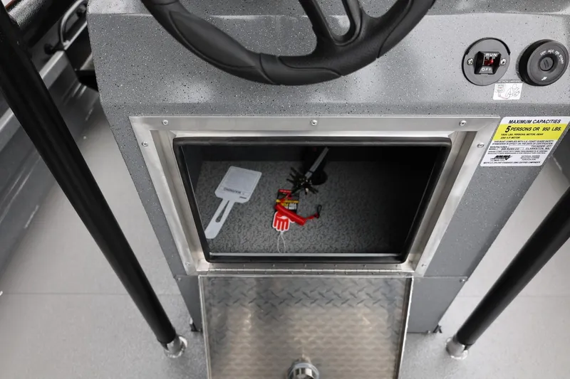 Slide: The Image of 2026 Thunder Jet 209 Rush Center Console storage compartment with steering wheel and control panel. - 35