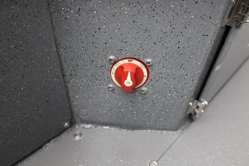 Slide: The Image of Red switch on Thunder Jet 209 Rush Center Console, 2026 model, with speckled gray surface. - 38