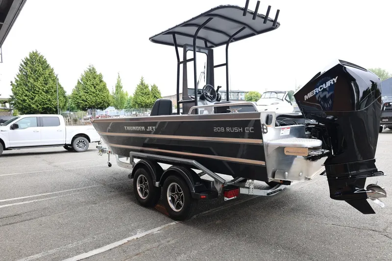 Slide: The Image of 2026 Thunder Jet 209 Rush Center Console boat with Mercury engine on trailer. - 7