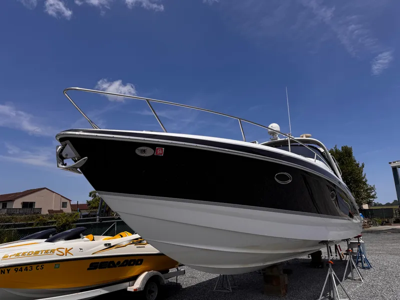 The Image of 2009 Formula 350ss boat on stands, clear sky background. - 0