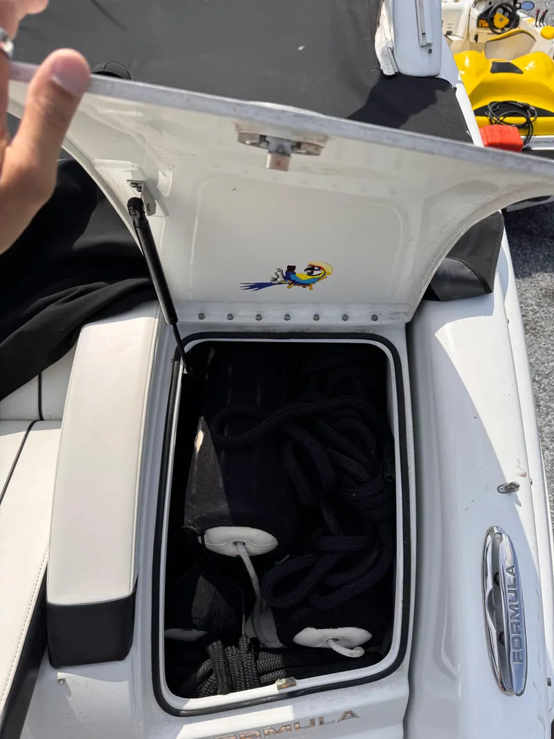 Slide: The Image of Interior of a 2009 Formula 350 Sun Sport boat with seating and kitchenette. - 26