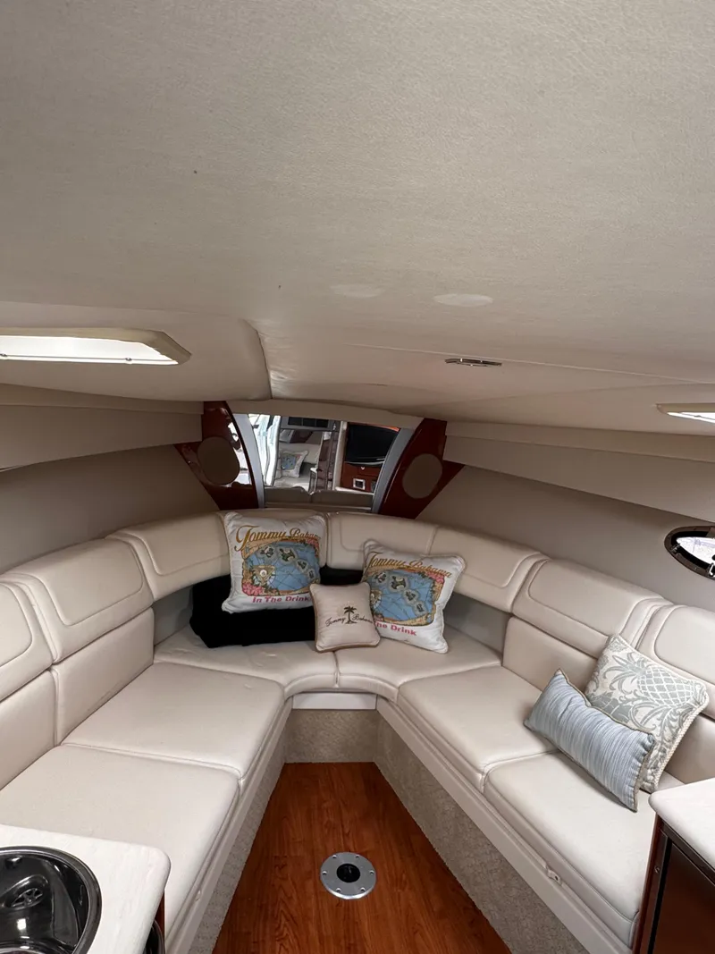 Slide: The Image of 2009 Formula 350 Sun Sport boat interior bathroom with modern amenities and wooden accents. - 29
