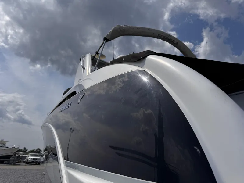 Slide: The Image of Control panel of a 2009 Formula 350ss boat with switches and keys. - 4