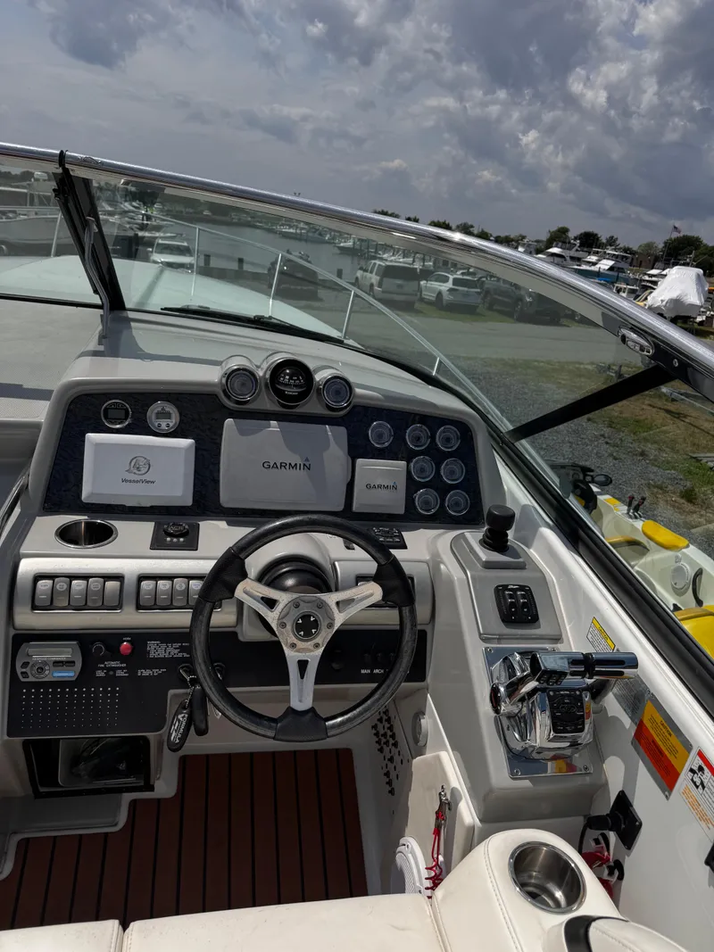 Slide: The Image of 2009 Formula 350ss boat on dry dock under clear blue sky. - 5