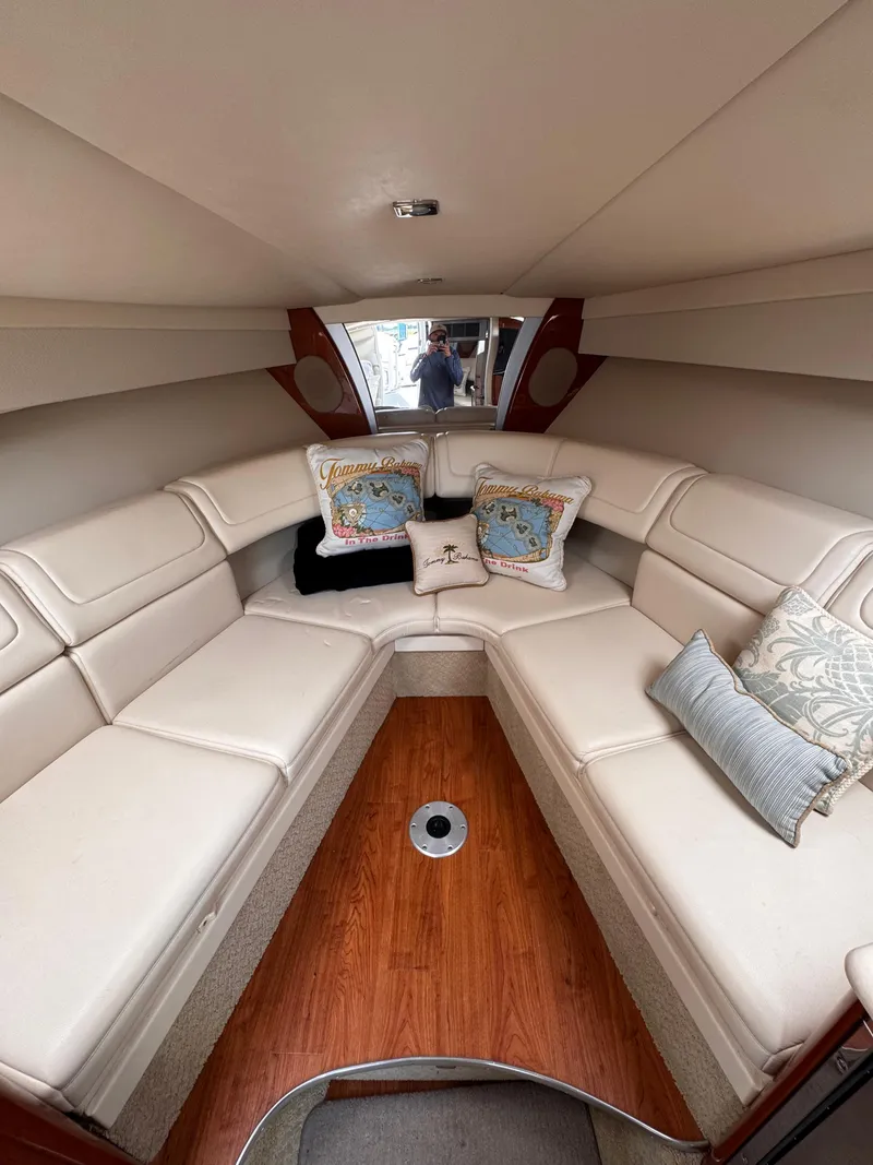 Slide: The Image of 2009 Formula 350ss boat dashboard with steering wheel and control panel under cloudy sky. - 8