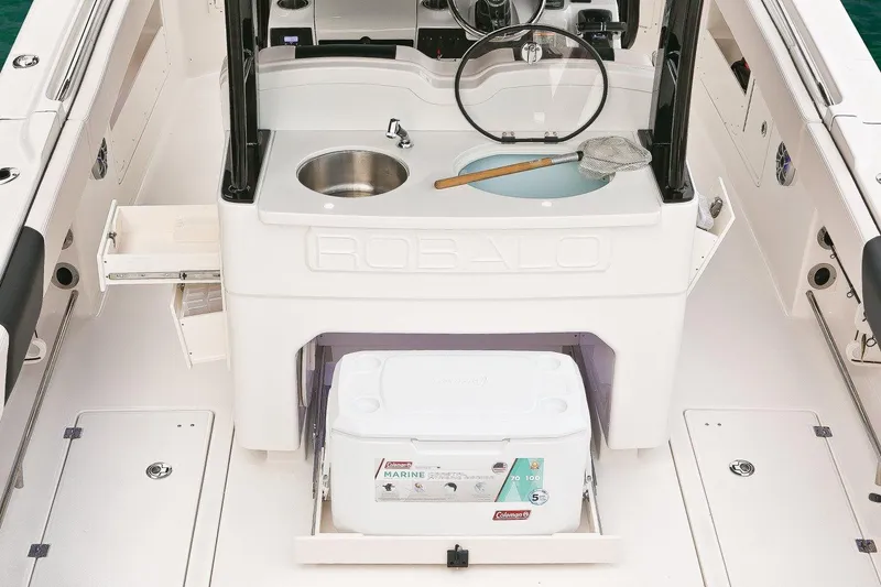 Slide: The Image of Manufacturer Provided Image: 2017 Robalo R302 Center Console boat interior with sink and cooler. - 10