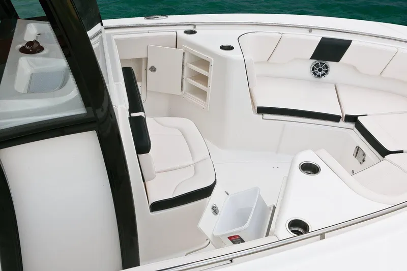 Slide: The Image of Manufacturer Provided Image: 2017 Robalo R302 Center Console boat interior with seating and storage compartments. - 4