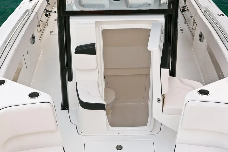Slide: The Image of Manufacturer Provided Image: 2017 Robalo R302 Center Console boat interior with open console door. - 7