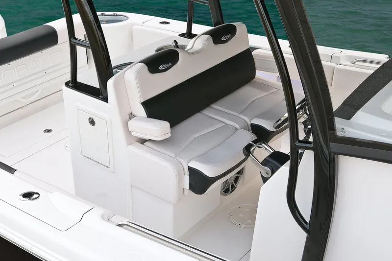 Slide: The Image of Manufacturer Provided Image: 2017 Robalo R302 Center Console boat seating area with black and white cushioned seats. - 9