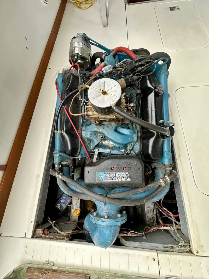 Slide: The Image of 1966 Bertram 31 Bahia Mar engine compartment with visible wiring and components. - 10
