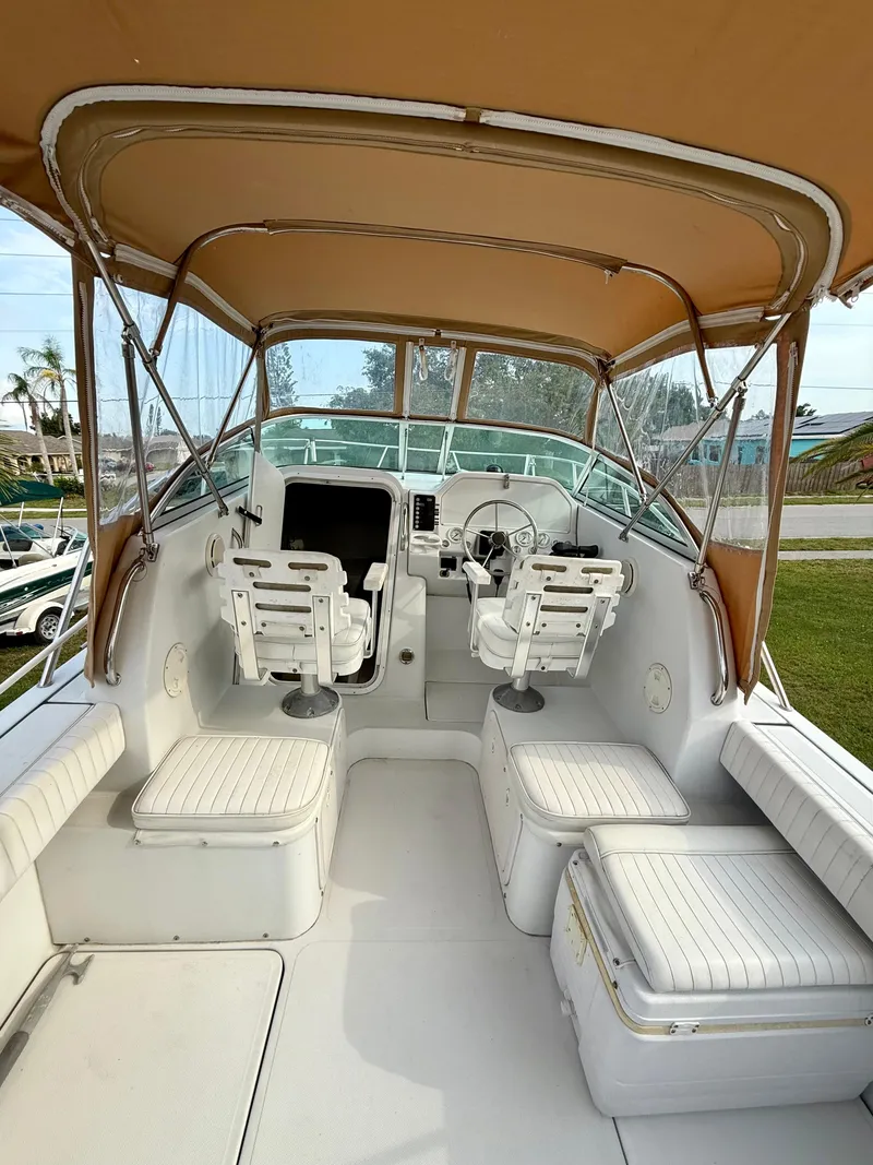 Slide: The Image of 2002 Glacier Bay 2670 Island Runner boat interior with seating and steering console. - 14