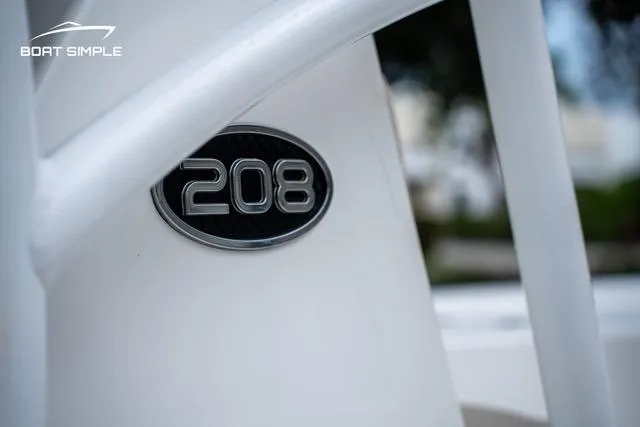 Slide: The Image of 2024 Sea Pro 208 Bay boat emblem close-up with sleek design elements. - 10