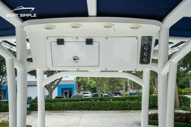 Slide: The Image of 2024 Sea Pro 208 Bay boat console with storage and controls, featuring a sleek design. - 11