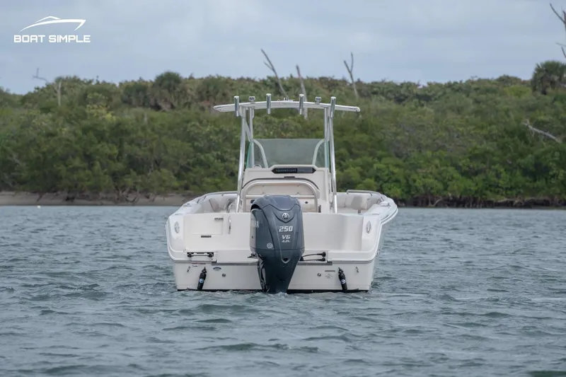 Slide: The Image of 2024 Sailfish 242 CC boat on water, rear view with outboard motor. - 3