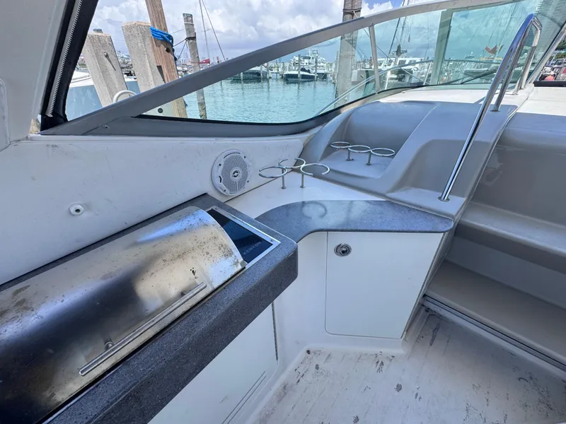Slide: The Image of Interior view of 2012 Sea Ray 330 Sundancer yacht with grill and cup holders. - 19