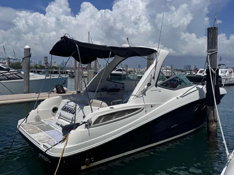 Slide: The Image of 2012 Sea Ray 330 Sundancer docked at marina under cloudy sky. - 4