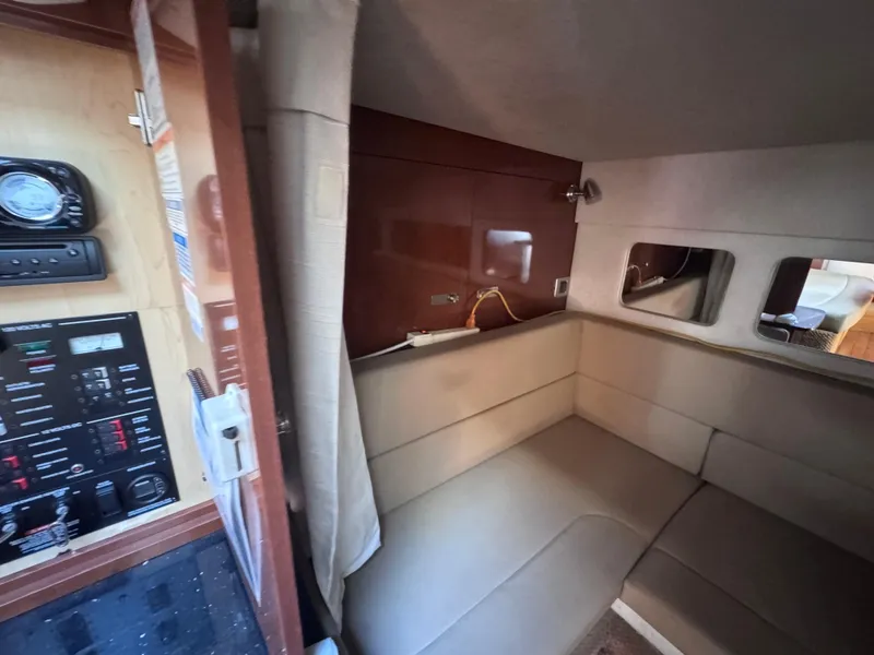 Slide: The Image of Interior cabin of 2012 Sea Ray 330 Sundancer with seating and control panel. - 40