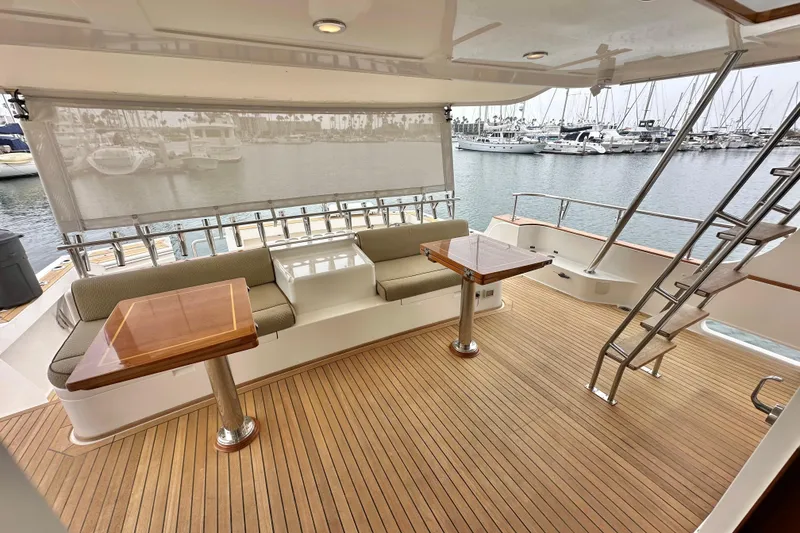 Slide: The Image of Luxurious 2006 Grand Banks 72 Yachtfisher with spacious deck and elegant seating area. - 10