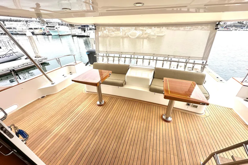 Slide: The Image of Luxurious 2006 Grand Banks 72 Yachtfisher with elegant teak deck and marina view. - 11
