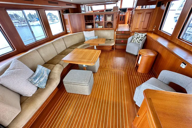 Slide: The Image of Luxurious 2006 Grand Banks 72 Yachtfisher interior with elegant wood finish and comfortable seating. - 15