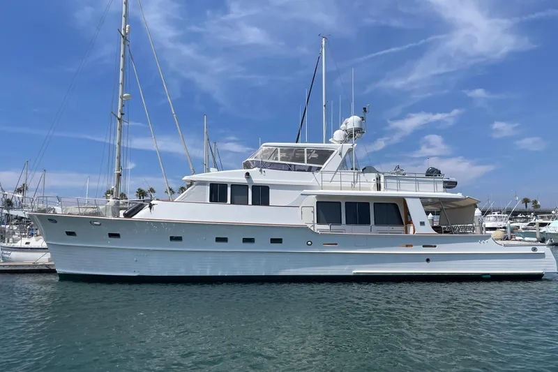 Slide: The Image of 2006 Grand Banks 72 Yachtfisher in marina, clear sky, calm water. - 2