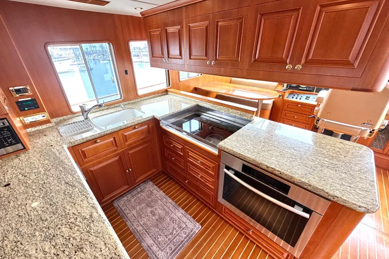 Slide: The Image of Luxurious kitchen interior of 2006 Grand Banks 72 Yachtfisher with granite countertops. - 22