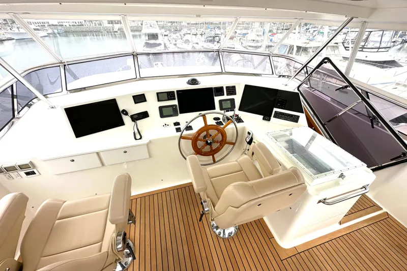 Slide: The Image of Helm of 2006 Grand Banks 72 Yachtfisher with modern controls and wooden steering wheel. - 26