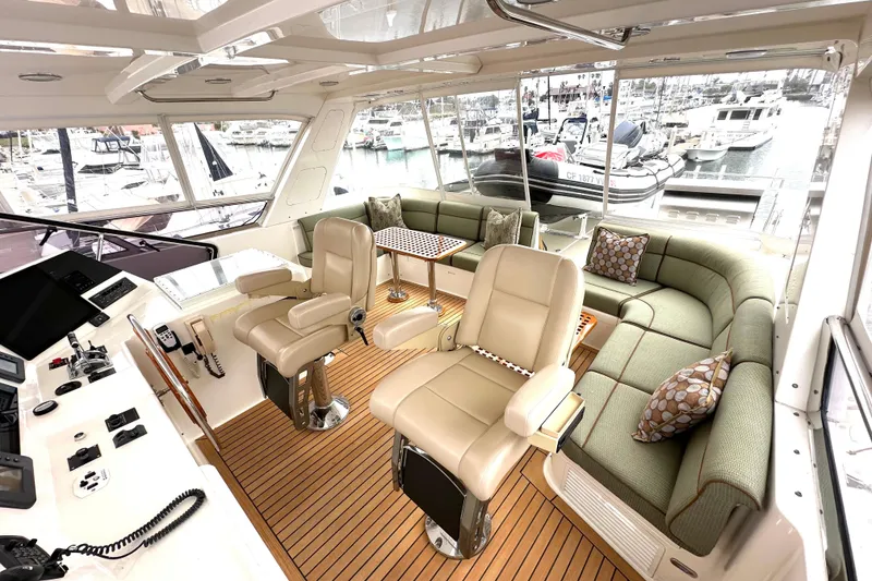 Slide: The Image of Luxurious 2006 Grand Banks 72 Yachtfisher interior with plush seating and modern helm. - 27
