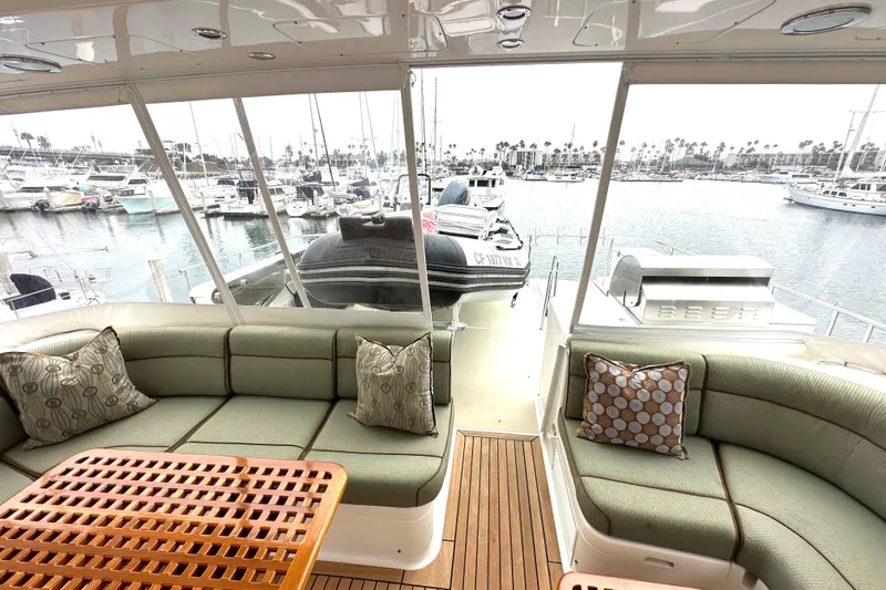 Slide: The Image of Luxurious 2006 Grand Banks 72 Yachtfisher interior with elegant seating and marina view. - 28