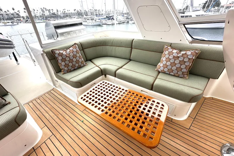 Slide: The Image of Luxurious 2006 Grand Banks 72 Yachtfisher interior with elegant seating and wooden table. - 30