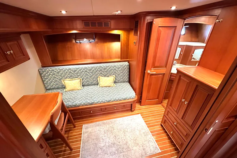 Slide: The Image of Luxurious 2006 Grand Banks 72 Yachtfisher interior with elegant wood finish and cozy seating area. - 35