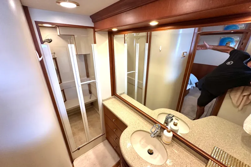 Slide: The Image of Luxurious bathroom in 2006 Grand Banks 72 Yachtfisher with shower and vanity. - 44