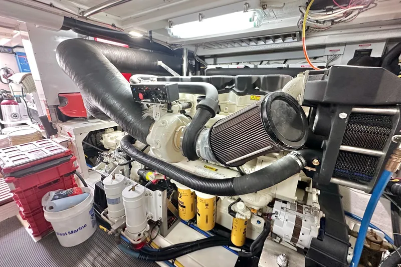 Slide: The Image of Engine room of 2006 Grand Banks 72 Yachtfisher, showcasing detailed mechanical components. - 46