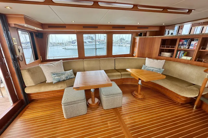 Slide: The Image of Luxurious 2006 Grand Banks 72 Yachtfisher interior with elegant wood finish and comfortable seating. - 17