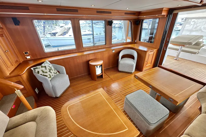 Slide: The Image of Luxurious 2006 Grand Banks 72 Yachtfisher interior with elegant wood finish and comfortable seating. - 18