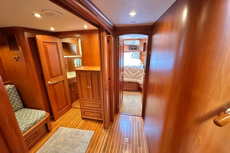 Slide: The Image of Luxurious interior of 2006 Grand Banks 72 Yachtfisher with wood paneling and cozy cabin. - 40