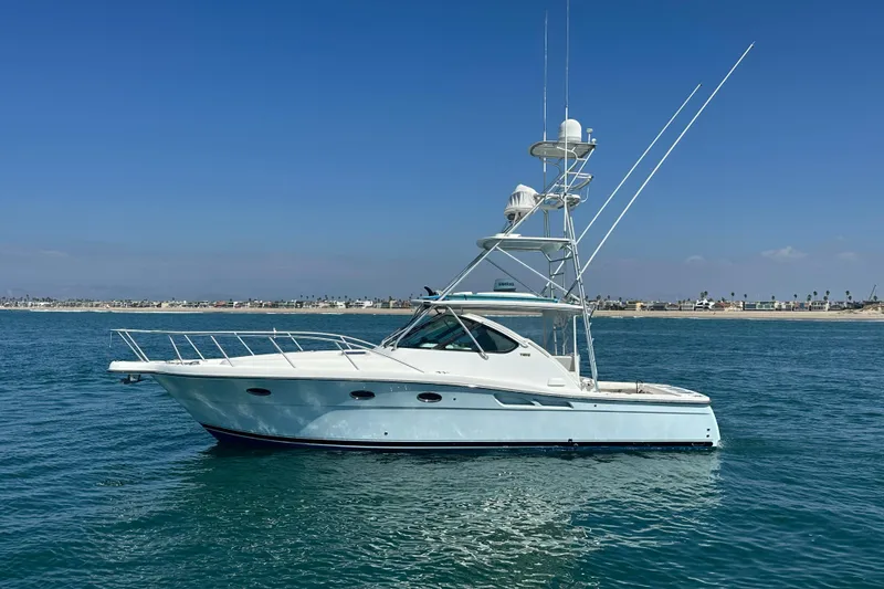 The Image of 2007 Tiara Yachts 3600 on calm water, clear sky, coastal background. - 0